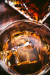 © Rebecca Peloquin/Stocksy - Closeup of whiskey on ice