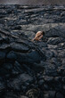 © Anastasia Mihaylova (Shpara)/Stocksy - Nude woman sitting on black solid lava field in Iceland