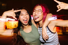Cheerful Chinese Women Having Fun At Night