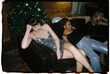 © BONNINSTUDIO/Stocksy - User generated content diverse ladies resting on couch during party