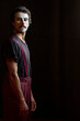 © Albert Martinez/Stocksy - Serious male mime with makeup gazing at camera