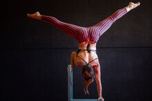 Anonymous Female Circus Artist Performing Handstand