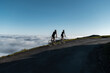 © Manu Prats/Stocksy - Cyclists riding on mountain trail