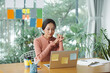 © Marc Tran/Stocksy - Businesswoman using computer in office