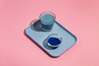 © Pixel Stories/Stocksy - Blue spirulina healthy superfood drink with glass, bottle and powder