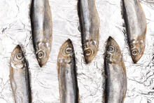 Shiny Aluminum Foil With Anchovy Fishes On It