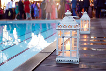 Candlelit Lanterns By A Pool During A Wedding Reception