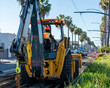 backhoe tractor street construction for transit line