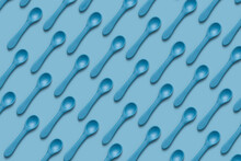 Seamless Pattern Of Silicone Blue Kid Spoons