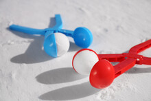 Snowballs And Plastic Tools Outdoors On Winter Day