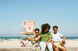 © Erin Brant/Stocksy - Fun family beach portrait