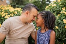 Multiracial Family Of Father And Daughter In The Park Outdoors