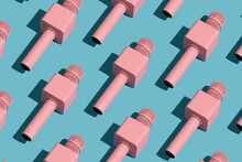 Pink Microphones On Blue Background. Repetition Pattern.