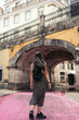 © Pedro Merino/Stocksy - Young woman in the pink street in Lisbon