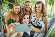 Group Of Women Friends In Swimsuits Taking A Selfie