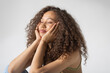 © Javier Pardina/Stocksy - Portrait of woman with afro hair