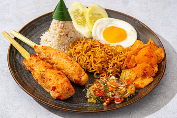 Wall Mural - sate lilit is a satay variant in Indonesia, originating from Balinese cuisine. This satay is made from minced chicken and spiced minced meat is wound around lemongrass sticks then grilled on charcoal