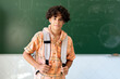 © Santi Nuñez/Stocksy - Boy Student portrait