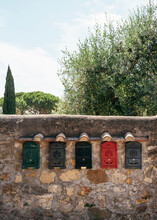 Row Of Mailboxes On A Wall In Tuscany.