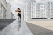 © Javier Pardina/Stocksy - City workout, woman training in an urban setting