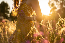 Young Carefree Woman Enjoying Nature At Sunset