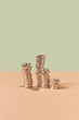 © Yaroslav Danylchenko/Stocksy - Stacks of cent coins on pastel background.
