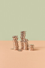 Stacks Of Cent Coins On Pastel Background.