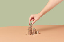 Cents Being Put In Stacks By Woman.