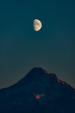 Moon Rises Over A Mountain
