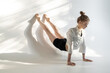 © Andriy Bezuglov/Stocksy - Female acrobat showing her capabilities in studio