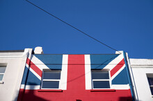 Row Of Houses One Painted With Union Jack