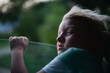 © Anna Malgina/Stocksy - A child catching a wind in a road trip