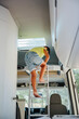 © VICTOR TORRES/Stocksy - Unrecognizable boy walking down the stairs inside a camper