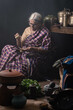 © Preeti B/Stocksy - A homemaker enjoying a cup of filter coffee