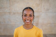 © Lupe Rodríguez/Stocksy - teenage black girl smiling outdoors