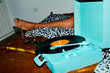 © Juan Moyano/Stocksy - turntable and man in the background lying down on the bed