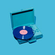 © Juan Moyano/Stocksy - violet vinyl in a blue portable turntable
