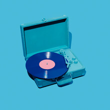 Violet Vinyl In A Blue Portable Turntable