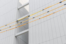 Close-up Of Building Walls And Yellow Wires.