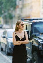 Calm Blond Woman Near The Luxury Car Outdoor