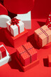 © Pixel Stories/Stocksy - Christmas presents. Red and white themed gift holiday background.