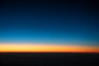 © Ronnie Comeau/Stocksy - Sunset From Airplane Window