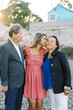 © Serena Burroughs/Stocksy - Parents with their adult daughter at the beach in new england