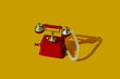 © Juan Moyano/Stocksy - old red telephone