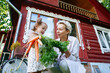 © AD Astra Team/Stocksy - Mom and daughter hold a bunch of carrots near a country house