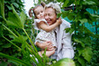 © AD Astra Team/Stocksy - Mom and daughter pick vegetables in the garden