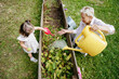 © AD Astra Team/Stocksy - Mom and daughter watering the garden