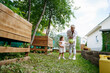 © AD Astra Team/Stocksy - Mom and daughter are picking cabbage in the garden