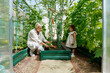 © AD Astra Team/Stocksy - Mom and daughter pick vegetables in the garden