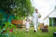 © AD Astra Team/Stocksy - Mom and daughter are picking cabbage in the garden